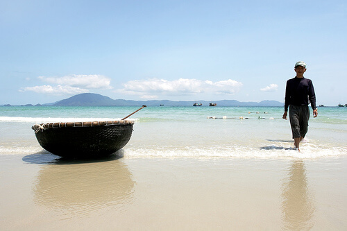 Doc Let beach's fisherman and his basket rowing boat