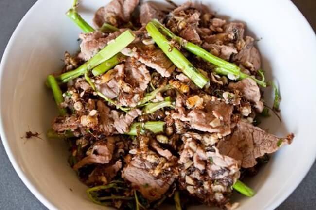 The dish is a mixture of beef, vegetables and a lot of tree ants