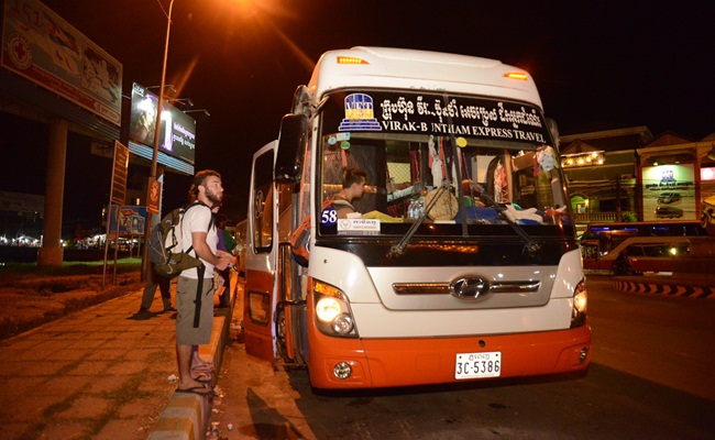 Foreign tourist getting on Virak Buntham's Night Bus from Phnom Penh to Siem Reap