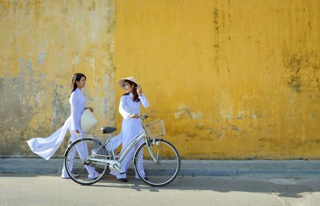 Beautiful Vietnamese Girls in the traditional dress Aodai in Hoi An Ancient Town